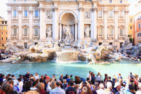 The Trevi Fountain in Rome, Italy, surrounded by tourists
