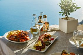 A Greek dinner for two by the water