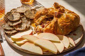 Baked Brie en Croute with crackers and sliced apples