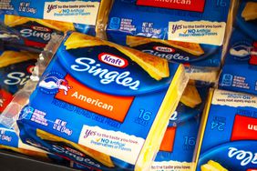 Several packages of Kraft Singles at a grocery store