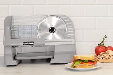 Meat Slicers with sandwiches and cold cuts near by