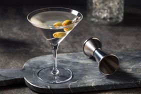 A classic gin martini garnishes with olives