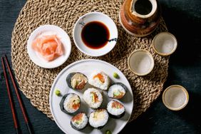 Sushi, ginger, soy sauce and sake